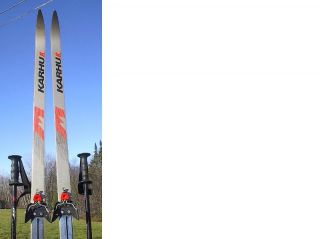 set of cross country skis with poles. The skis are signed KARHU