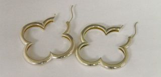 pair of clover motif pierced earrings by Heidi Klum. Details include